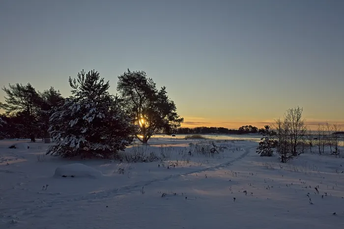 Framed Print : Sunrise at seashore on a cold winter day with snow covered ground