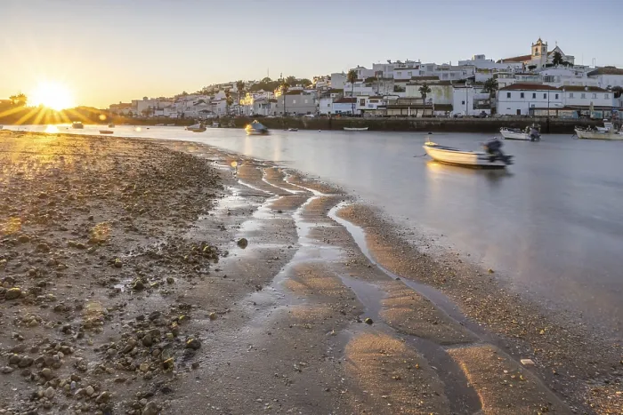 Framed Print : Sunrise with view over a beach and harbour basin at low tide Framed Print : Sunrise with view over a beach and harbour basin at low tide
