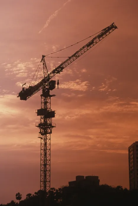 Framed Print : Sunset at background of construction crane