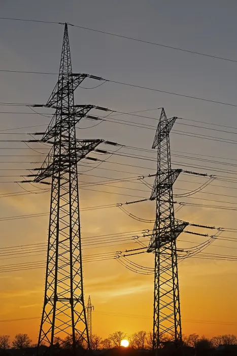 Framed Print : Sunset behind high-voltage pylons