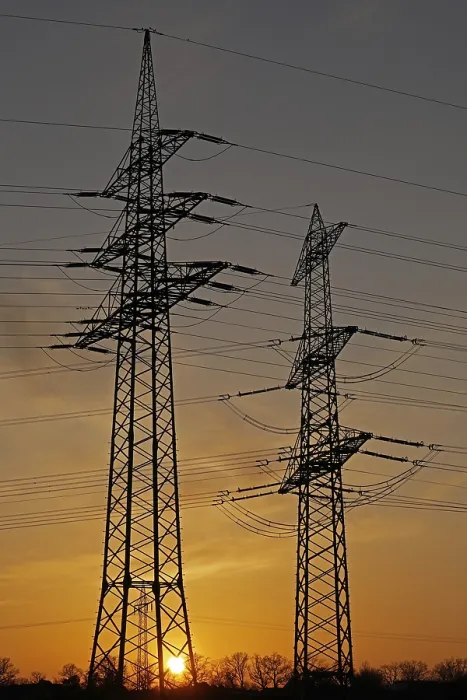 Framed Print : Sunset behind high-voltage pylons