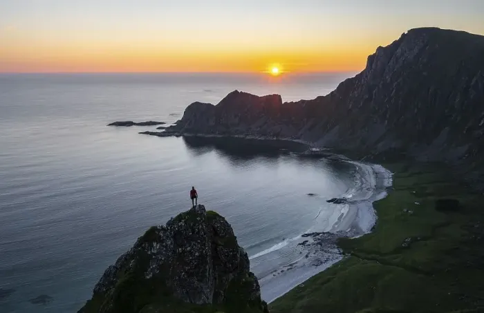 Framed Print : Sunset, hiker on rocks, cliffs