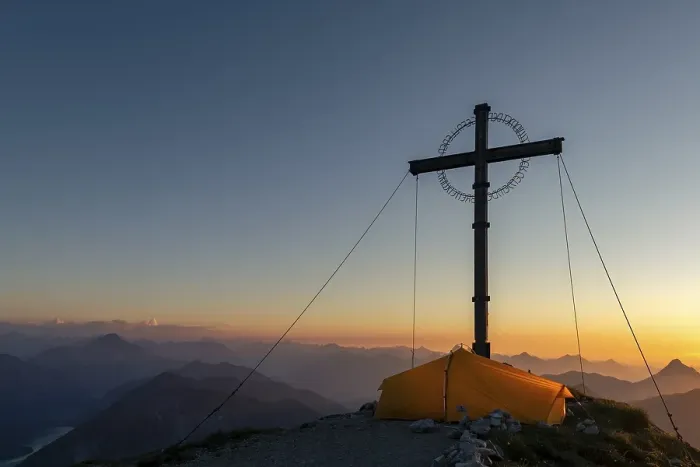 Framed Print : Sunset over Lechtal mountains, in the foreground summit cross of the Geierkopf with tent