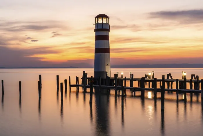 Framed Print : Sunset, lighthouse at sunset, long exposure