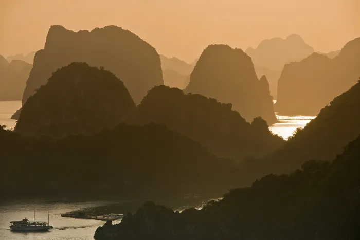 Framed Print : Sunset, limestone cliffs with vegetation in Halong Bay Framed Print : Sunset, limestone cliffs with vegetation in Halong Bay