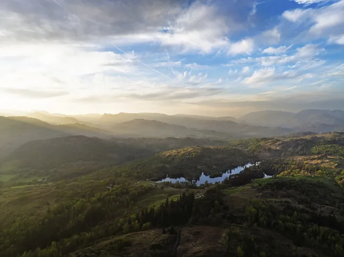 Framed Print : Sunset over Mountains and Coniston Water from drone Framed Print : Sunset over Mountains and Coniston Water from drone