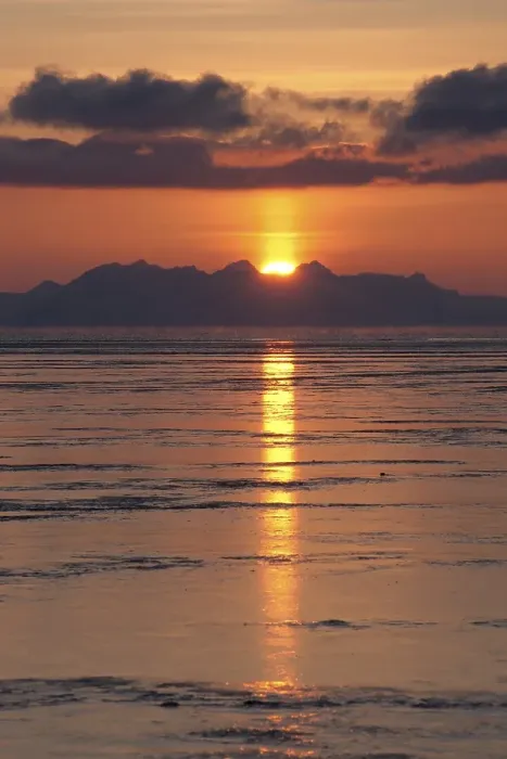 Framed Print : Sunset behind the mountains of the Isfjorden with reflections in the tidal flats