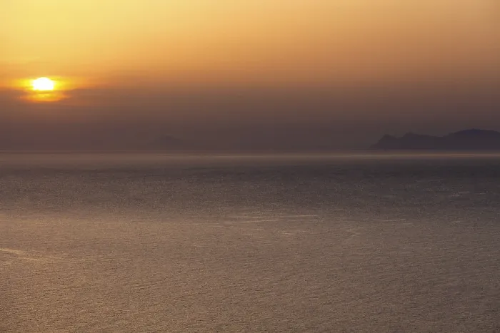Framed Print : Sunset over the sea near Santorini
