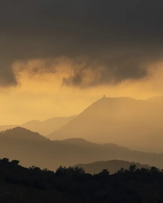 Framed Print : Sunset with stormy cloud sky and dramatic orange sunlight above mountain Troodos mountains Cyprus