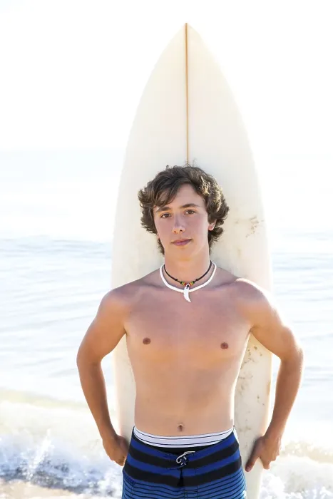 Framed Print : Surfer handsome boy teenager with surfboard in beach shore