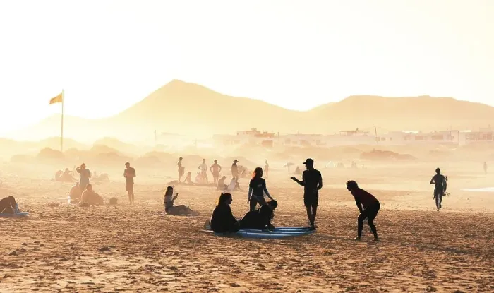Framed Print : Surfers on the beach, Playa Famara
