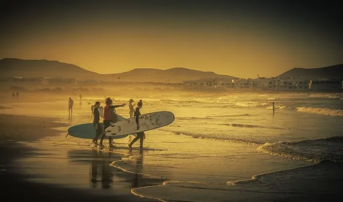 Framed Print : Surfers on the beach, Playa Famara