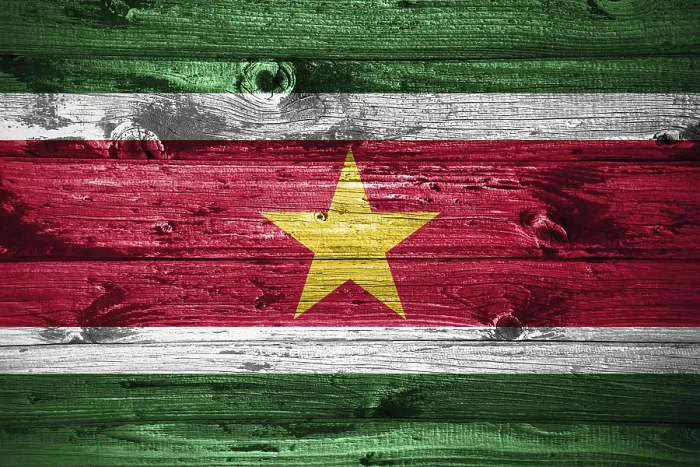 Framed Print : Suriname flag on wooden planks background wood flag