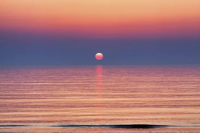 Framed Print : Surreal sunset at the sea, smooth water surface