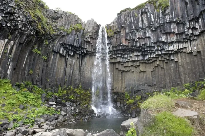 Framed Print : Svartifoss waterfall, water rushing over rocks