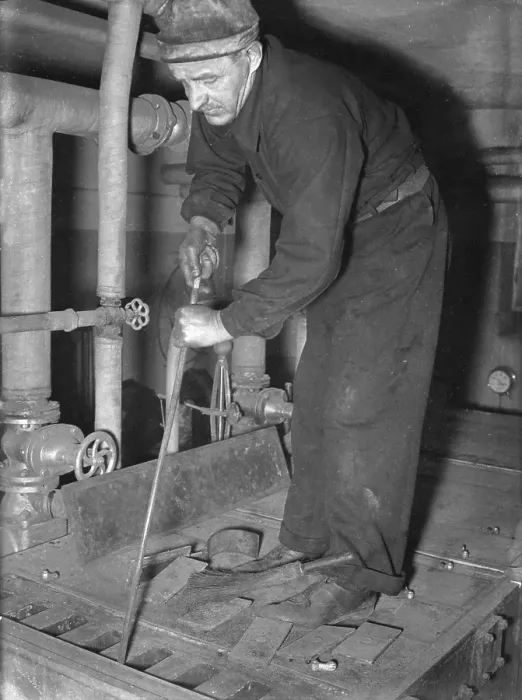 Framed Print : Sweeper in 1940. A chimney sweep working to clean the boiler room, using special tools for the purpose. June 1940. Kristoffersson ref 154-10 Framed Print : Sweeper in 1940. A chimney sweep working to clean the boiler room, using special tools for the purpose. June 1940. Kristoffersson ref 154-10