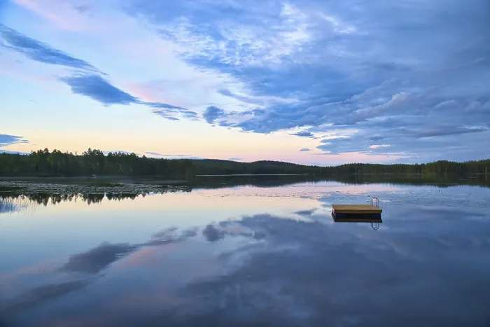 Framed Print : Swimming island in Sweden on a lake at sunset