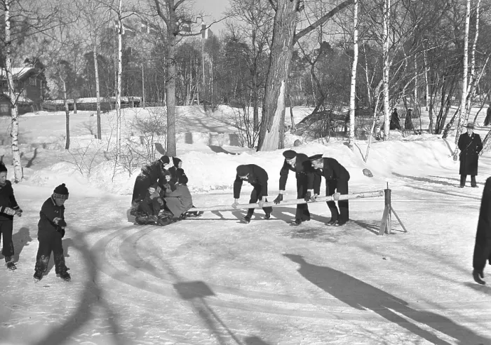 Framed Print : Swing toboggan in the 1940s. Three sailors in uniform is powering the sledge circling around a centrum pole Framed Print : Swing toboggan in the 1940s. Three sailors in uniform is powering the sledge circling around a centrum pole