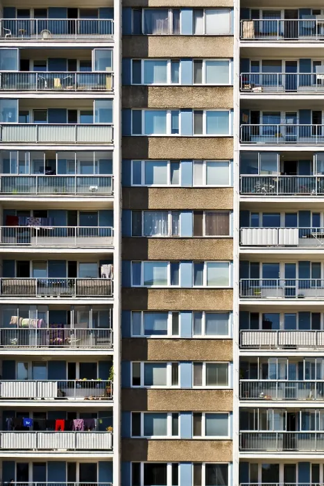 Framed Print : A symmetrical high-rise apartment building with balconies