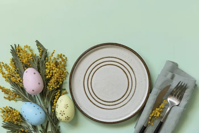 Framed Print : Table setting for Easter dinner with easter eggs and mimosa on a pastel background Framed Print : Table setting for Easter dinner with easter eggs and mimosa on a pastel background