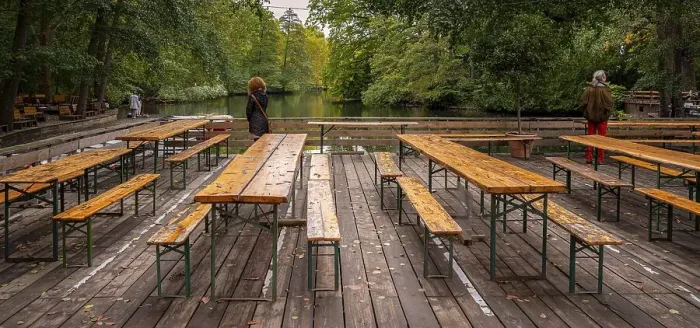 Framed Print : Tables and benches in an empty beer garden in the park Framed Print : Tables and benches in an empty beer garden in the park