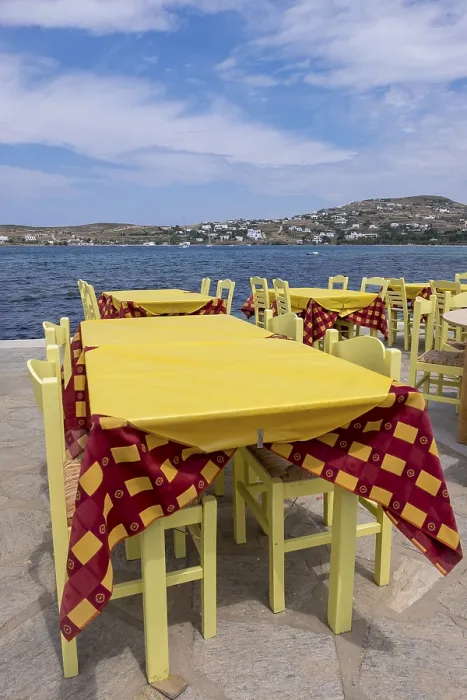 Framed Print : Tables in a restaurant by the sea in Parikia