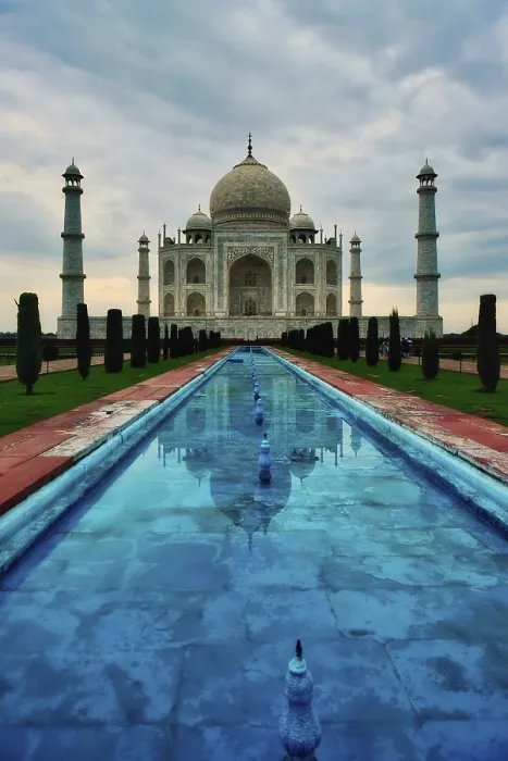Framed Print : Taj Mahal reflected in water under a cloudy sky