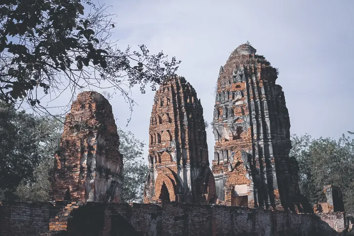 Framed Print : Tall brick ruins and towers reaching towards the sky amidst surrounding trees
