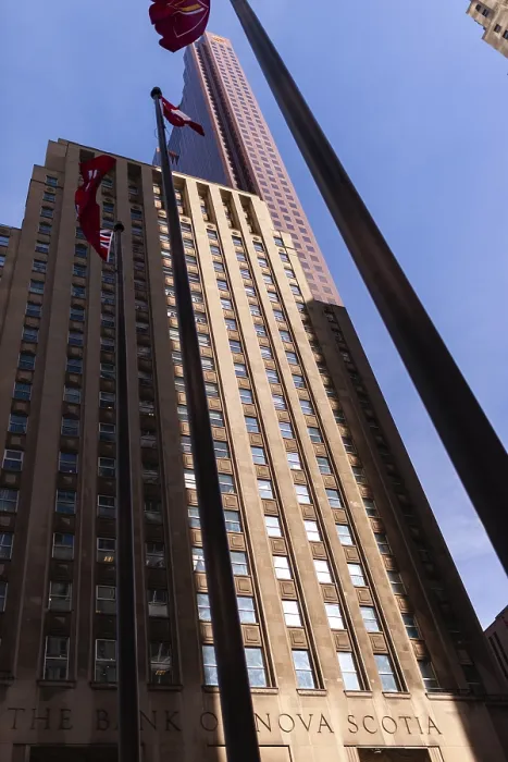 Framed Print : Tall building with flags against a clear blue sky in a city environment in Toronto