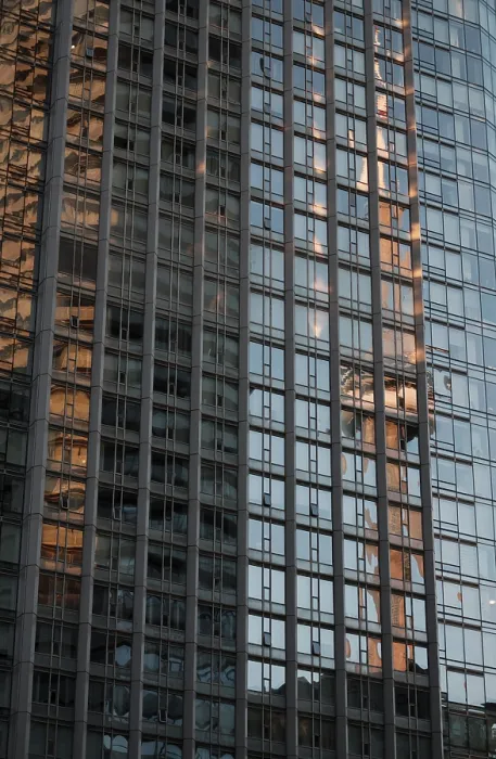 Framed Print : Tall glass building reflecting the CN Tower and a blue sky with a grid pattern in Toronto