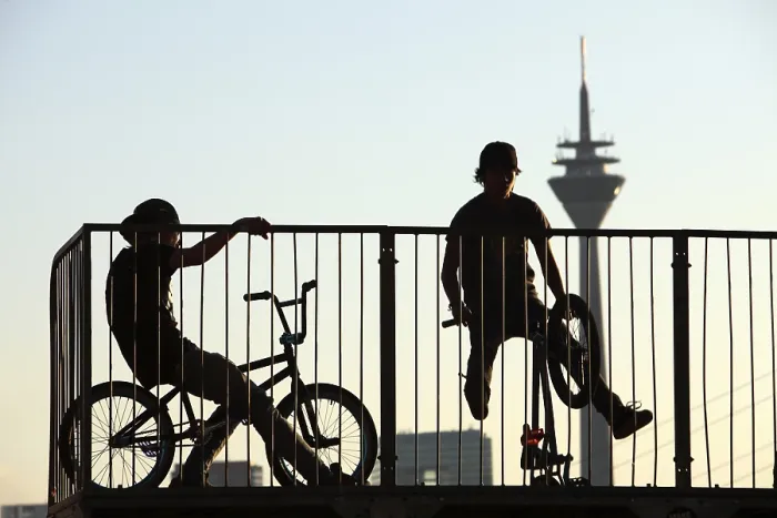 Framed Print : Teenagers with BMX bikes at a halfpipe on the Rhine