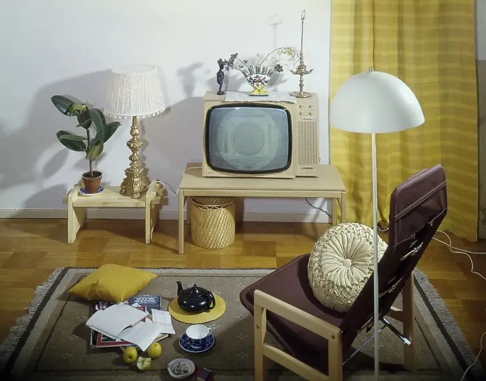 Framed Print : Television in the 1960s. Interior from a room with a typical 1960s television set on a special tv furniture