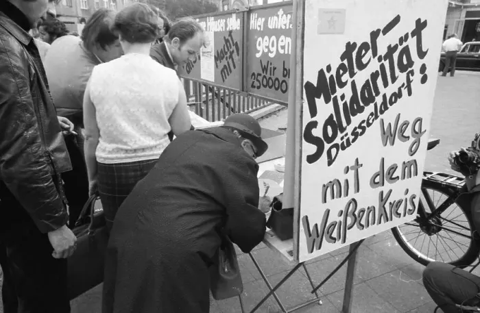 Framed Print : Tenants protest with a collection of signatures Framed Print : Tenants protest with a collection of signatures