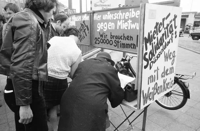 Framed Print : Tenants protest with a collection of signatures Framed Print : Tenants protest with a collection of signatures