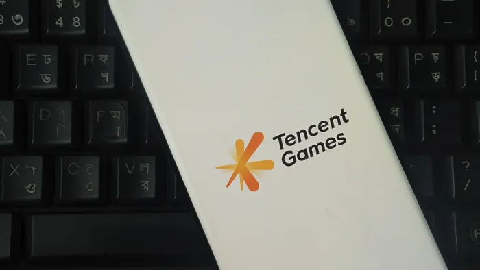 Framed Print : Tencent Games logo on a smartphone placed over a black keyboard