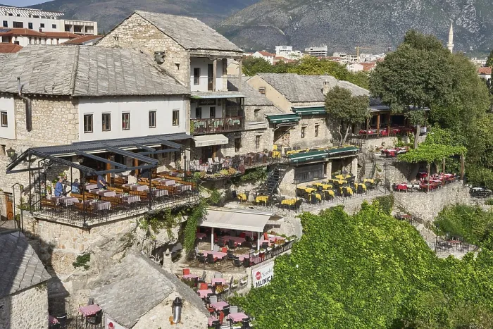 Framed Print : Terraces of restaurants on the banks of the river Neretva