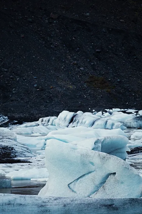 Framed Print : Textured ice formations stand out against a dark