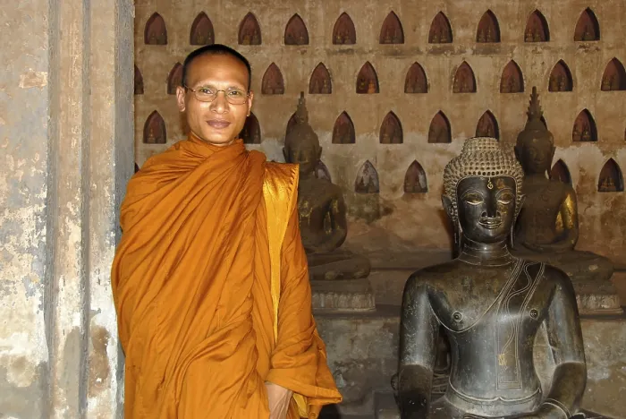 Framed Print : Theravada Buddhism, monk dressed in orange robes
