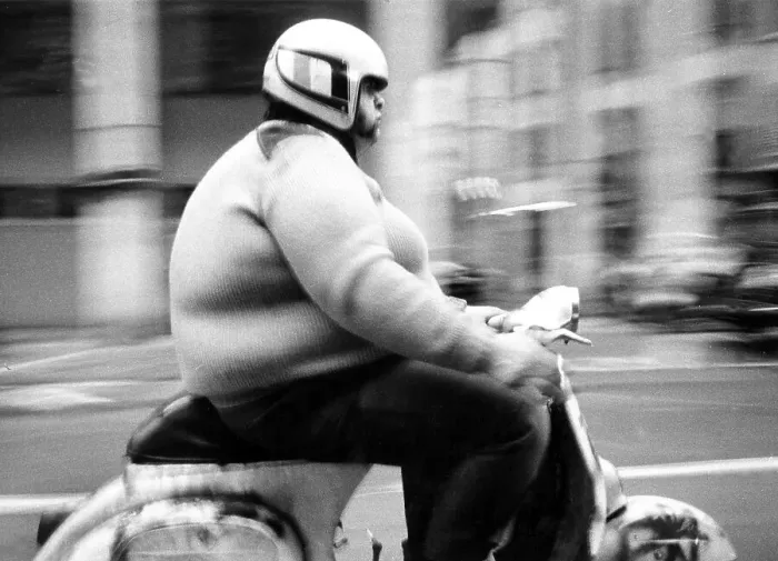 Framed Print : Thick man on a scooter, between 50s and 60s Framed Print : Thick man on a scooter, between 50s and 60s