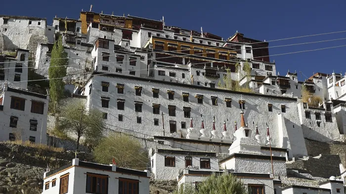 Framed Print : Thiksey monastery, large ensemble of buildings with white walls and windows under blue sky