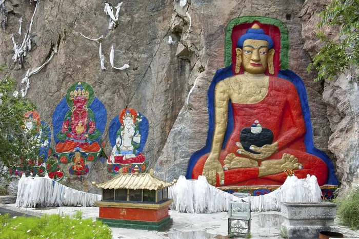 Framed Print : Tibetan Buddhism, colorful Atisha rock relief with a large Buddha Shakyamuni