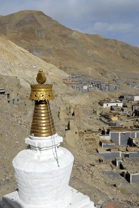 Framed Print : Tibetan Buddhism stupa with golden top traditional houses with grey
