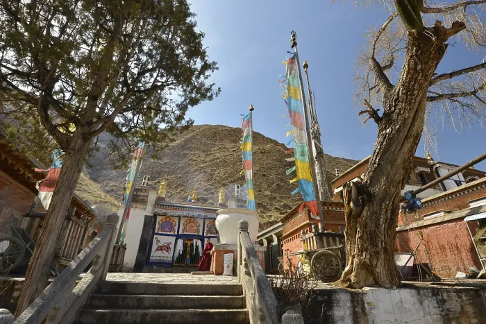 Framed Print : Tibetan Buddhism, stupa and monastery buildings with prayer flags built in the traditional architectural style