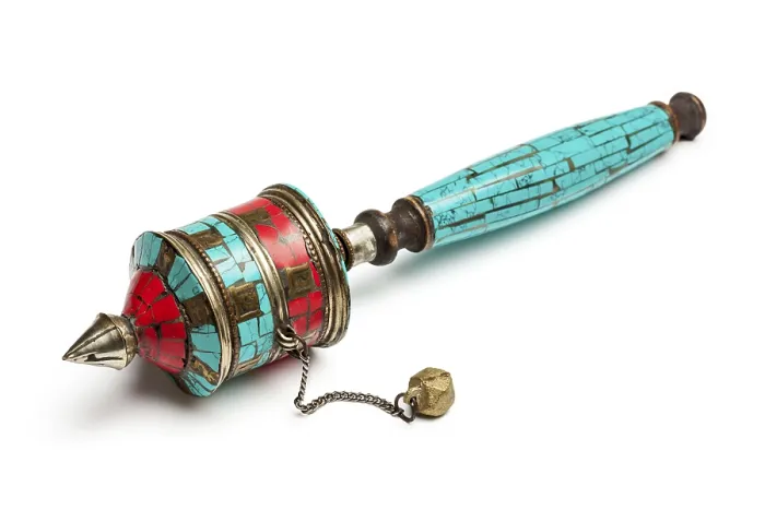 Framed Print : Tibetan buddhist Mani wheel or hand prayer wheel isolated on white