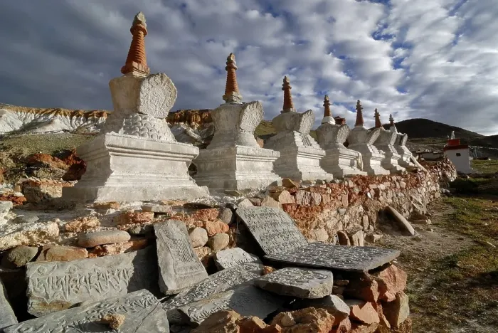 Framed Print : Tibetan Mani Stones in front of Chorten or Stupas at the holy pilgrimage site of Thirtapuri
