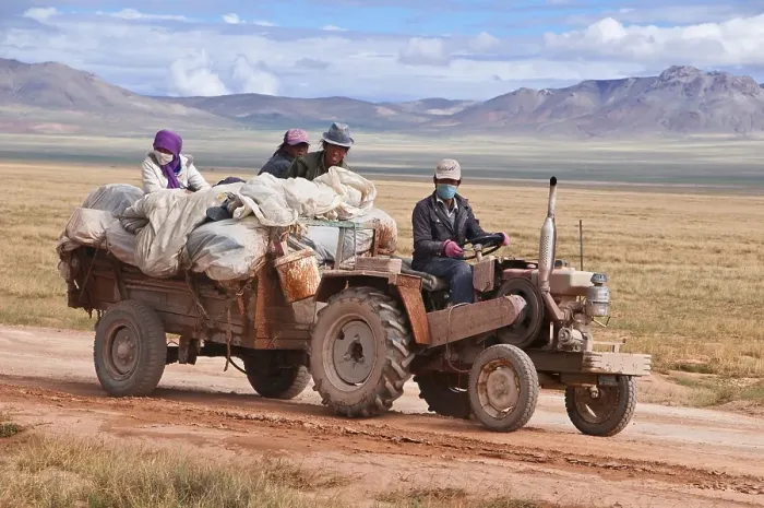 Framed Print : Tibetan pilgrims on a tractor on the road from Gerze to Tsochen