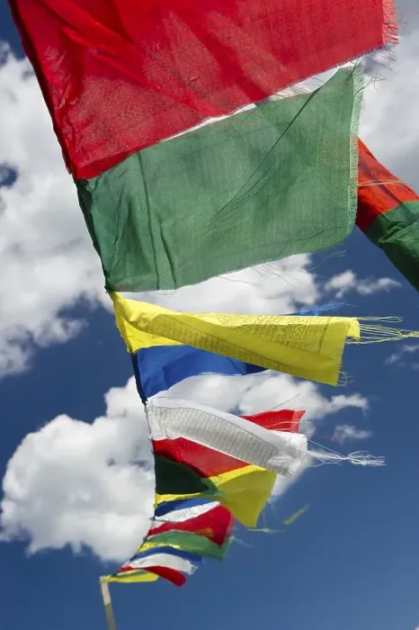 Framed Print : Tibetan prayer flags against a blue sky with clouds