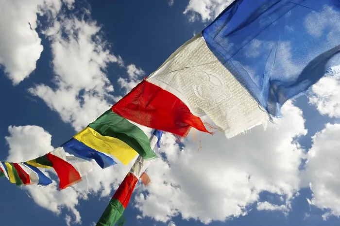 Framed Print : Tibetan prayer flags against a blue sky with clouds Framed Print : Tibetan prayer flags against a blue sky with clouds