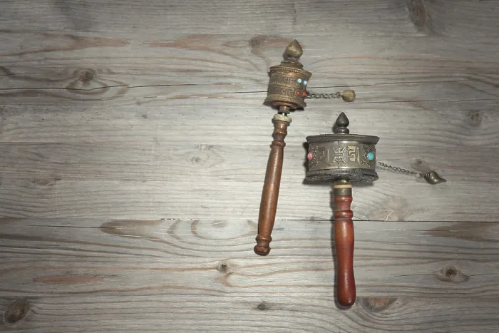 Framed Print : Tibetan prayer wheel or mani wheel on old wooden background with copy space Framed Print : Tibetan prayer wheel or mani wheel on old wooden background with copy space