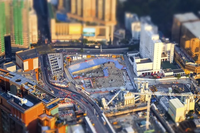 Framed Print : Tilt shift blur effect. Amazing aerial cityscape view with crane working at building construction Framed Print : Tilt shift blur effect. Amazing aerial cityscape view with crane working at building construction